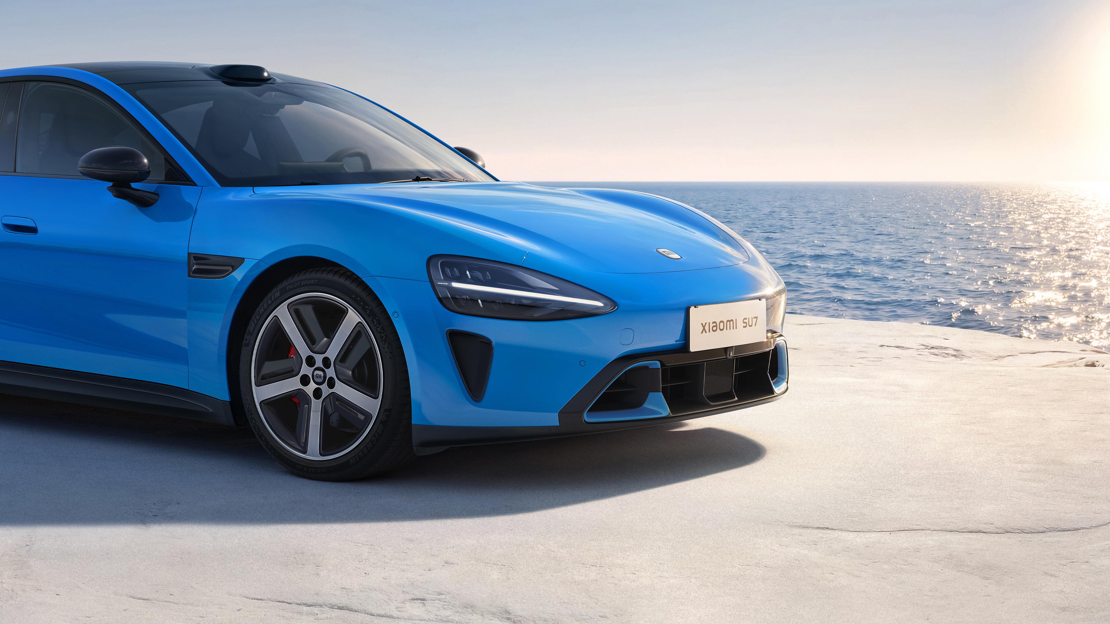 Blue Xiaomi SU7 Near Ocean - 4K Background Blue Xiaomi SU7 Near Ocean - Automotive Photography 4K Wallpaper (3840x2160)